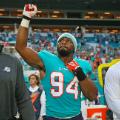 Miami Dolphins defensive end Robert Quinn (94) gives a fist pump while listening to the national anthem before the start of a preseason game against the Tampa Bay Buccaneers at Hard Rock Stadium in Miami Gardens, Fla., on Thursday, Aug. 9, 2018. David Santiago/Miami Herald/TNS/Getty Images